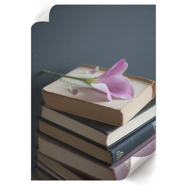 Wall art featuring a floral motif with books