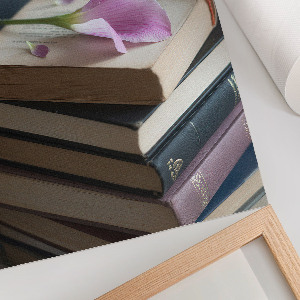 Wall art featuring a floral motif with books