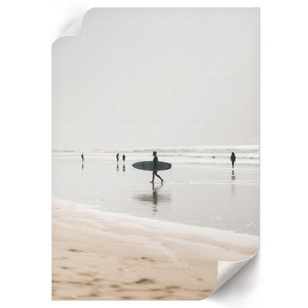 Wall art depicting surfers on the beach