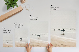 Wall art depicting surfers on the beach