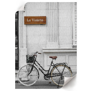 Decorative poster showing a bike leaning against a wall
