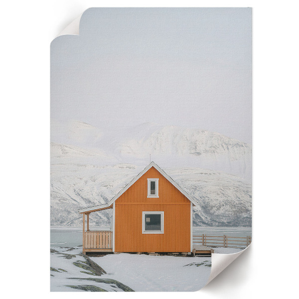 Wall art depicting a mountain cottage