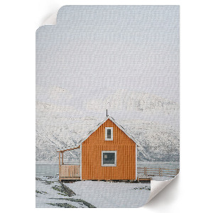Wall art depicting a mountain cottage