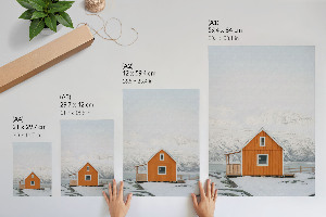 Wall art depicting a mountain cottage