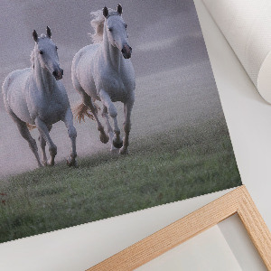 Wall art featuring galloping horses