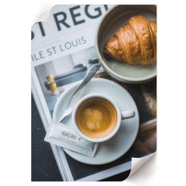 Wall print featuring a cup of coffee and a croissant
