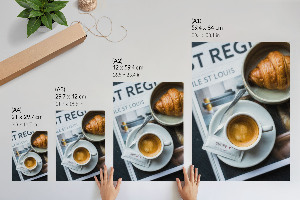 Wall print featuring a cup of coffee and a croissant