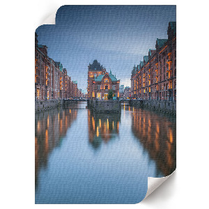 Wall art depicting a cityscape at evening
