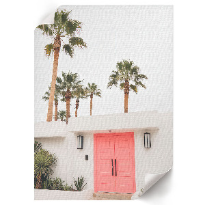 Wall art with palm trees printed on a door