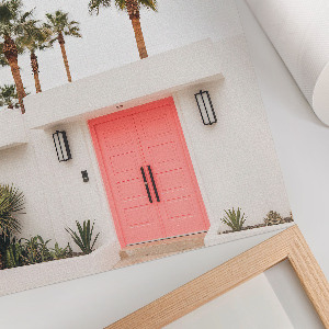 Wall art with palm trees printed on a door
