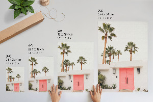 Wall art with palm trees printed on a door