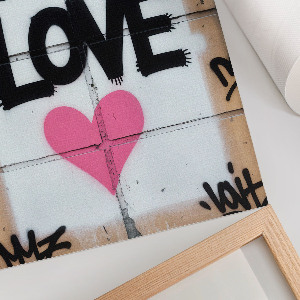 Wall art featuring 'Love' graffiti