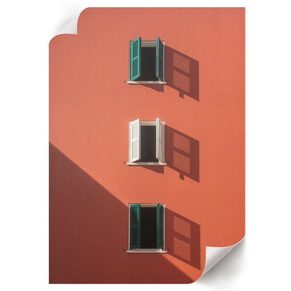 Wall art featuring an orange building facade